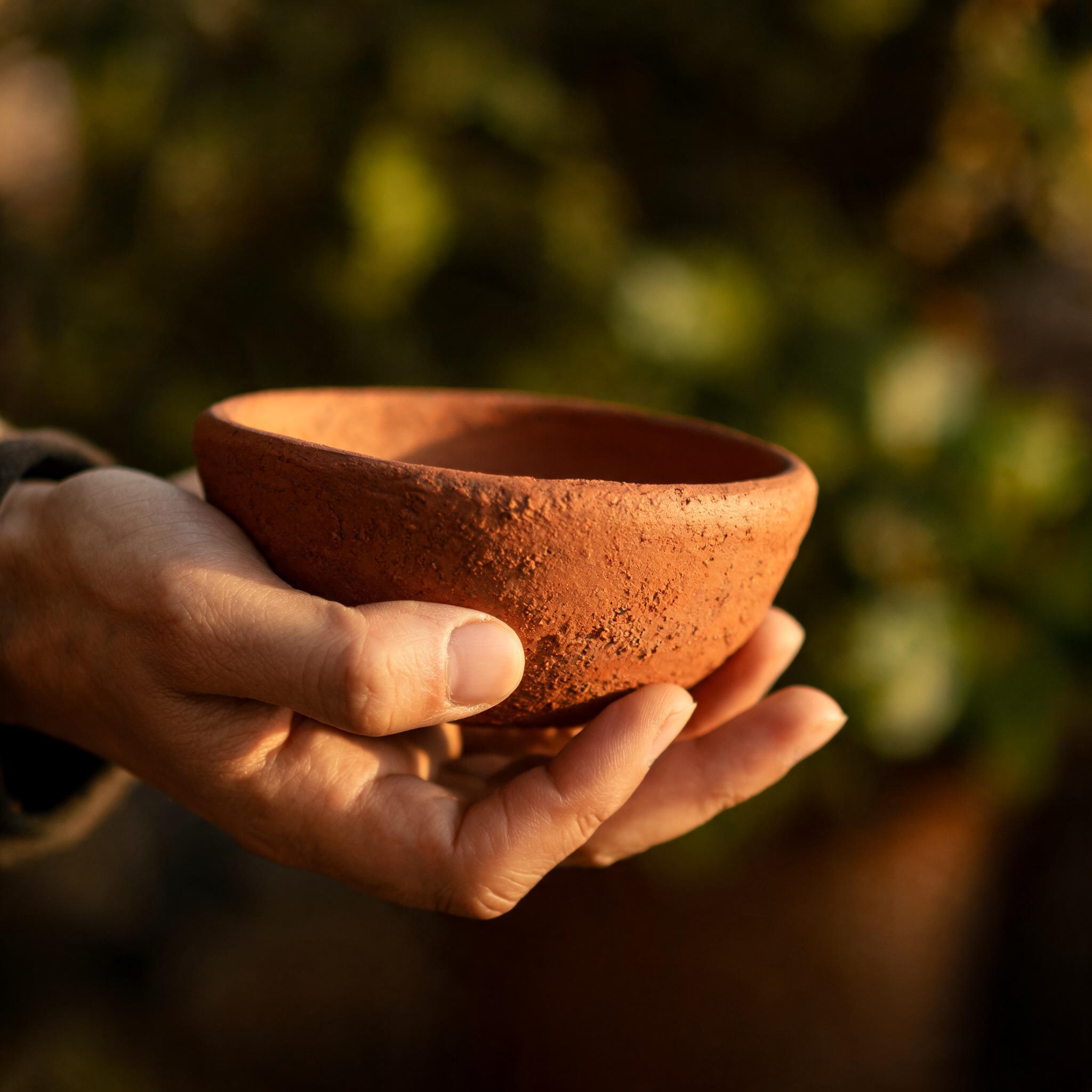 A Tanah Bara Rimba Bowl, thrown from Balinese laterite clay, unglazed exterior revealing the raw terracotta body. Diameter 28 cm.